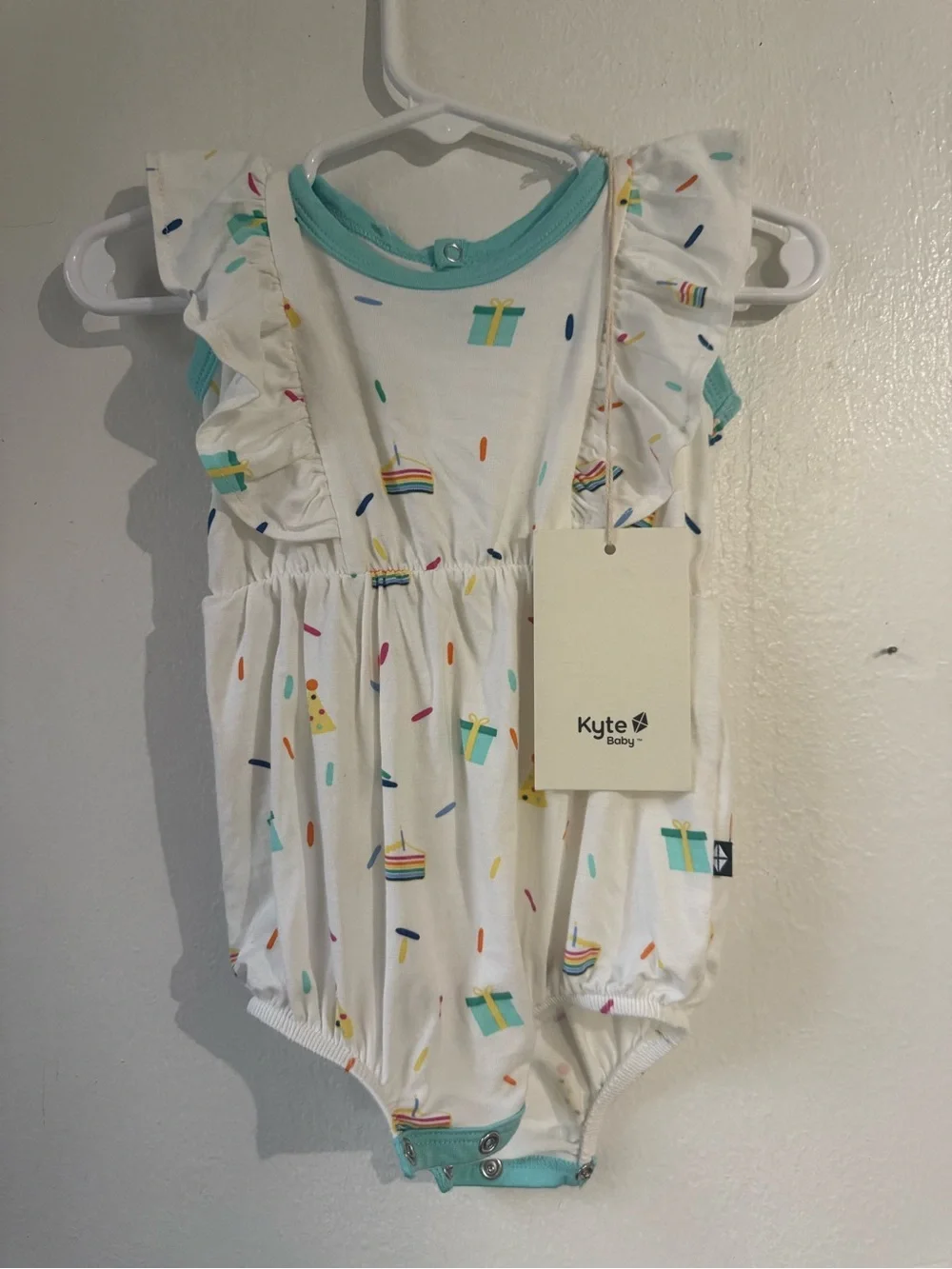 Kyte BABY White Romper with Teal Trim and Colorful Sprinkles
